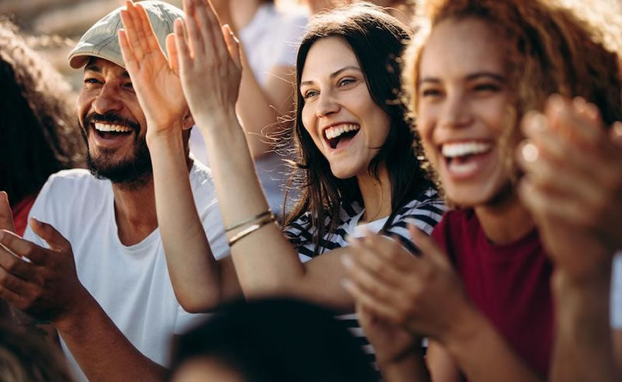 Happy People In Crowd Without Masks