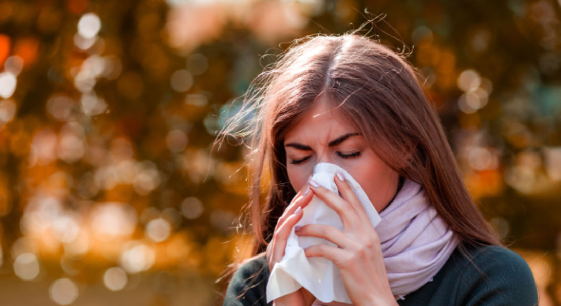 Woman Sneezing from Seasonal Allergies: TRU47 Silver Solutions