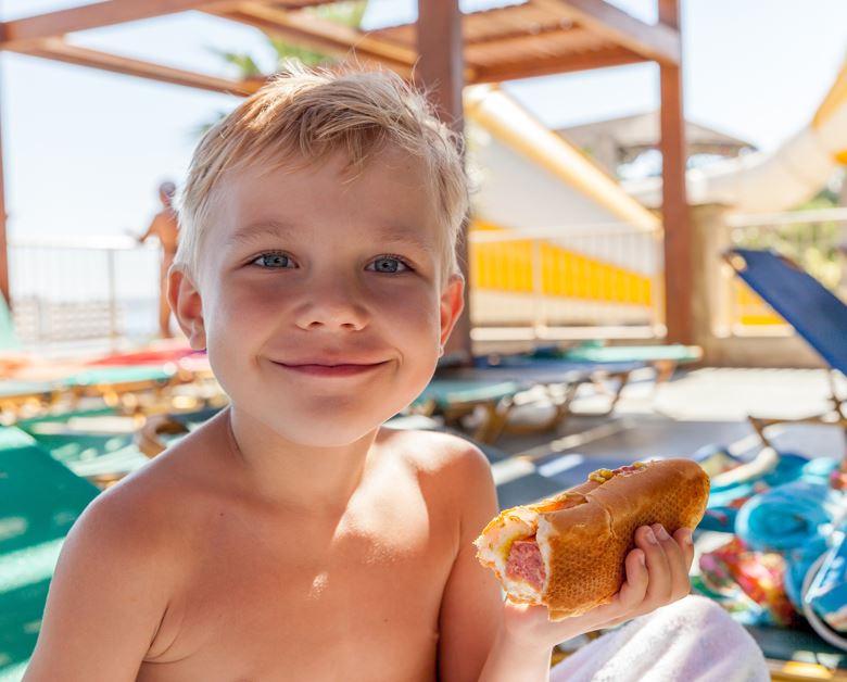 Child Holding Hotdog Celebrating Labor Day