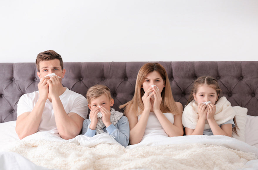 Family Sick in Bed During Flu Season
