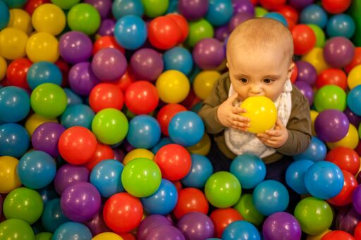 Toddler in Bouncy Ball Playground