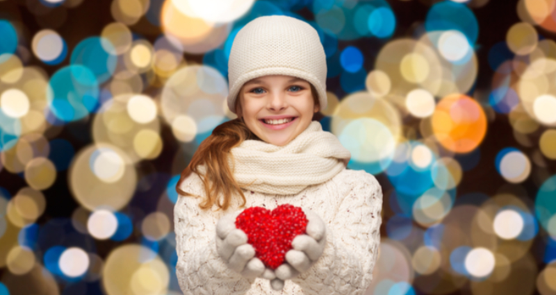 Girl Holding Heart Celebrating Giving Tuesday