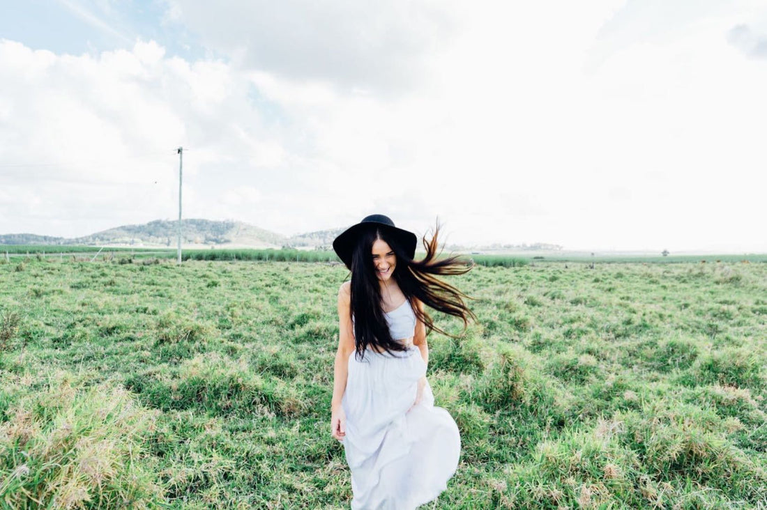 Happy Woman Walking in Field
