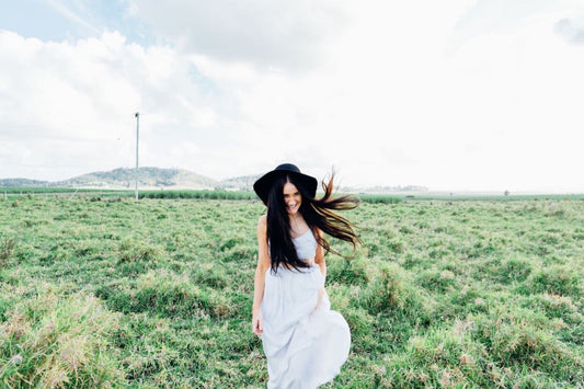 Happy Woman Walking in Field