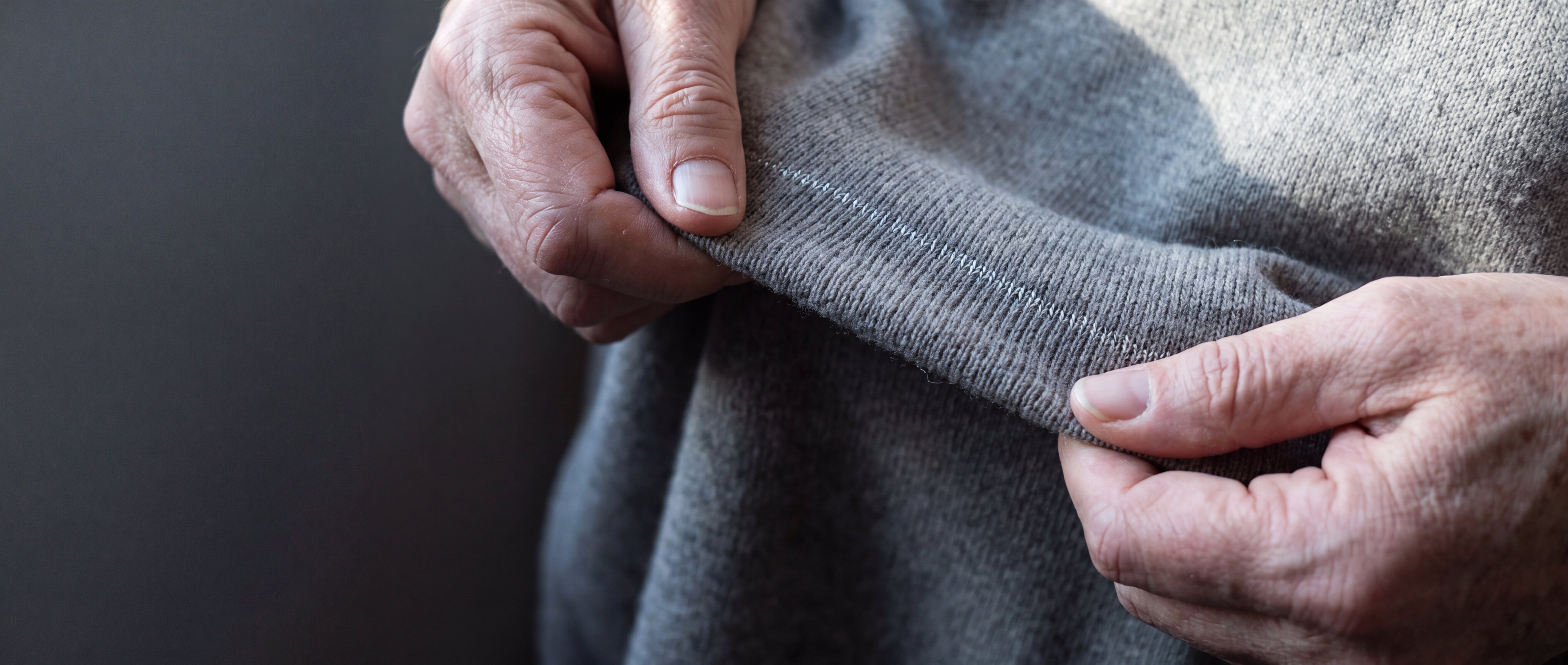 Knitted fabric with a fine silver thread catching the light